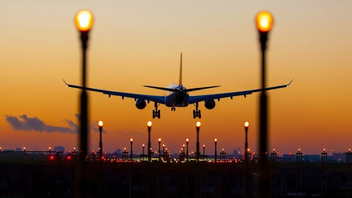 Commercial plane sunset landing