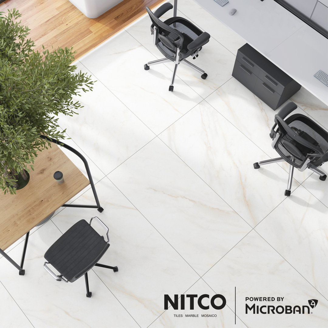 View from above of a modern office with Nitco ceramic tiles, with Nitco logo and Powered by Microban logo